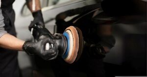 Car Detailing Professional polishing car exterior with a tool